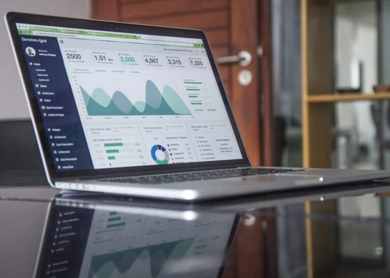 Marketing analytics dashboard showing website traffic and conversions on a laptop